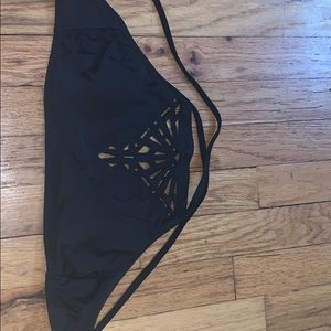black bikini top with cutout patterns in the front